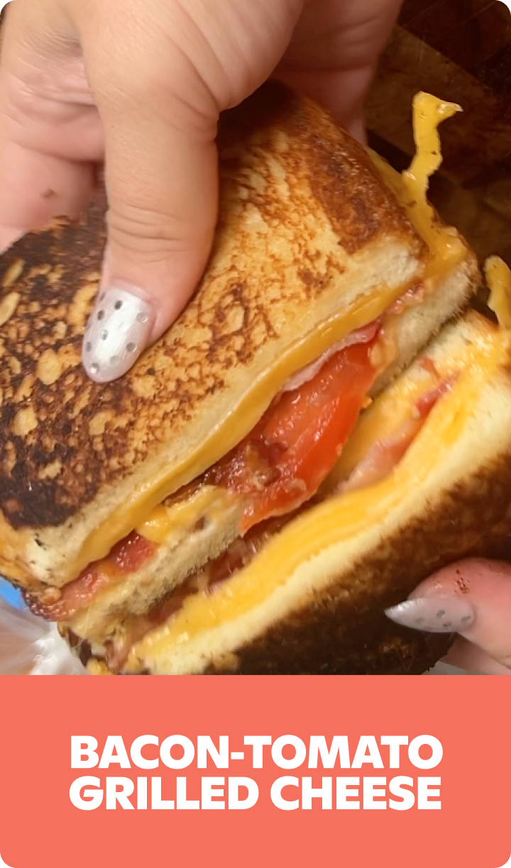 Gopuff's Bacon-Tomato Grilled Cheese sandwich, pulled apart to show melted cheese, bacon, and tomato.