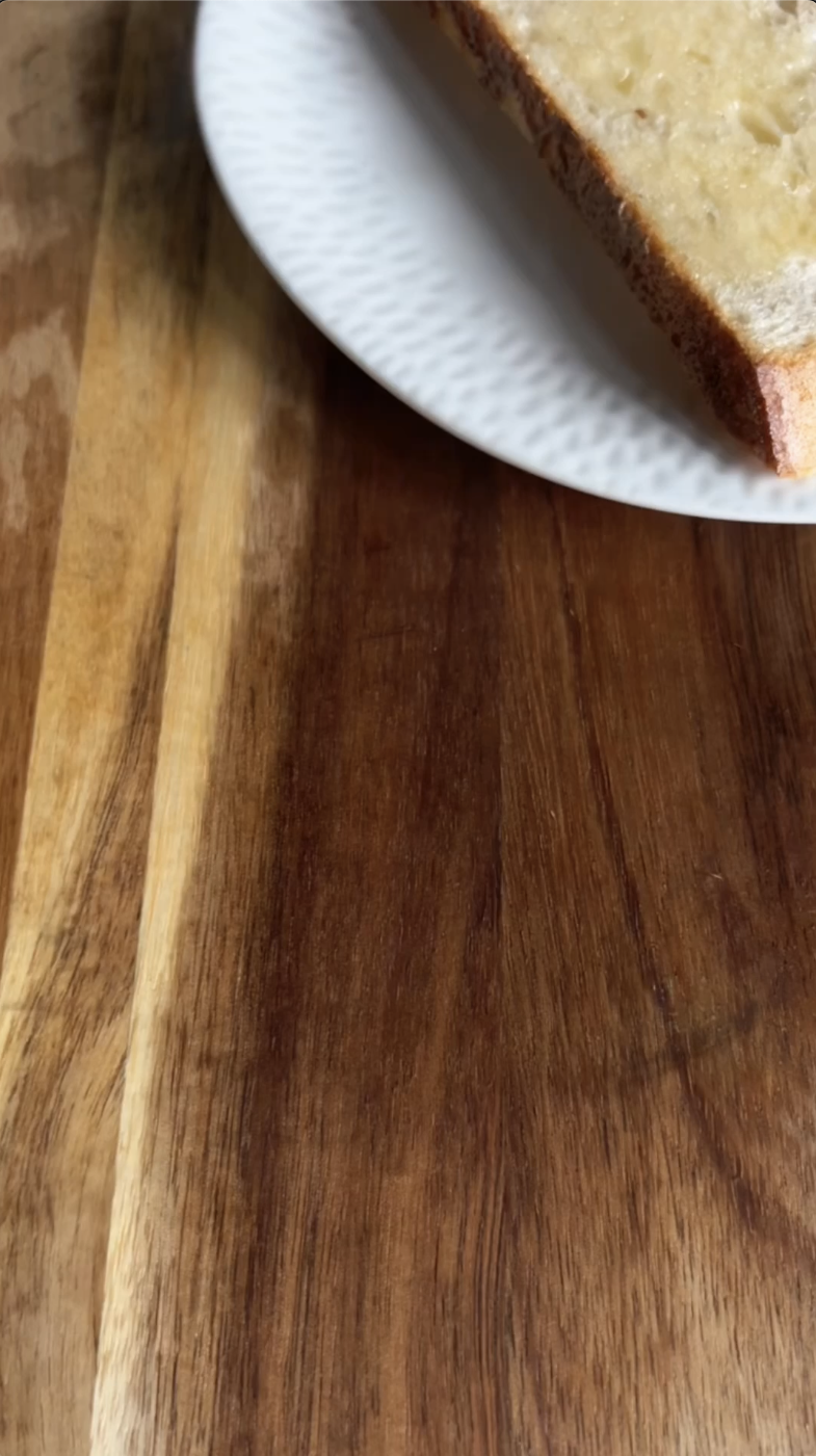 Gopuff: Slice of buttered toast on a white plate. Order breakfast snacks & more.