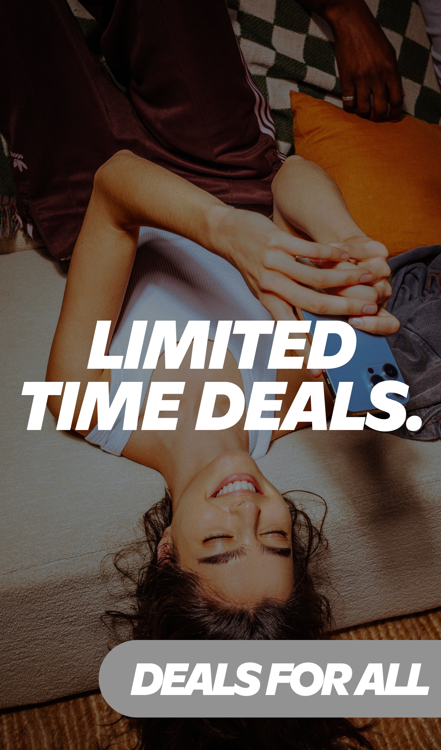 Gopuff limited time deals promotion with smiling woman holding a blue iPhone while lying on a couch.