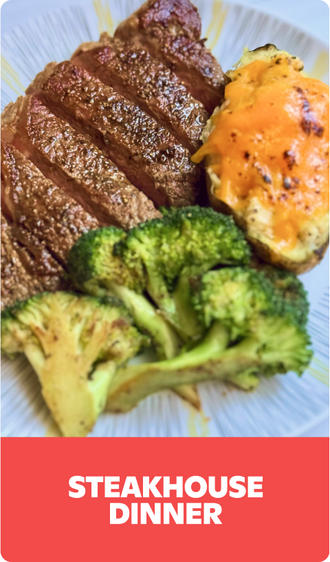 Steakhouse dinner with sliced steak, cheesy baked potato, and broccoli.