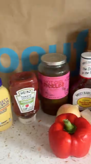 Gopuff delivery: Grey Poupon mustard, Heinz ketchup, Hot Girl Pickles, Sweet Baby Ray's BBQ sauce, bell pepper, onion.