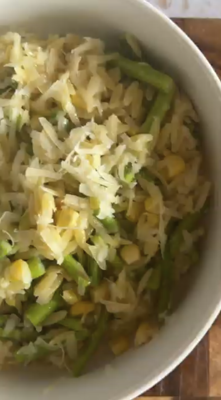 Bowl of pasta with shredded cheese, green beans, and corn from Gopuff. Order now!