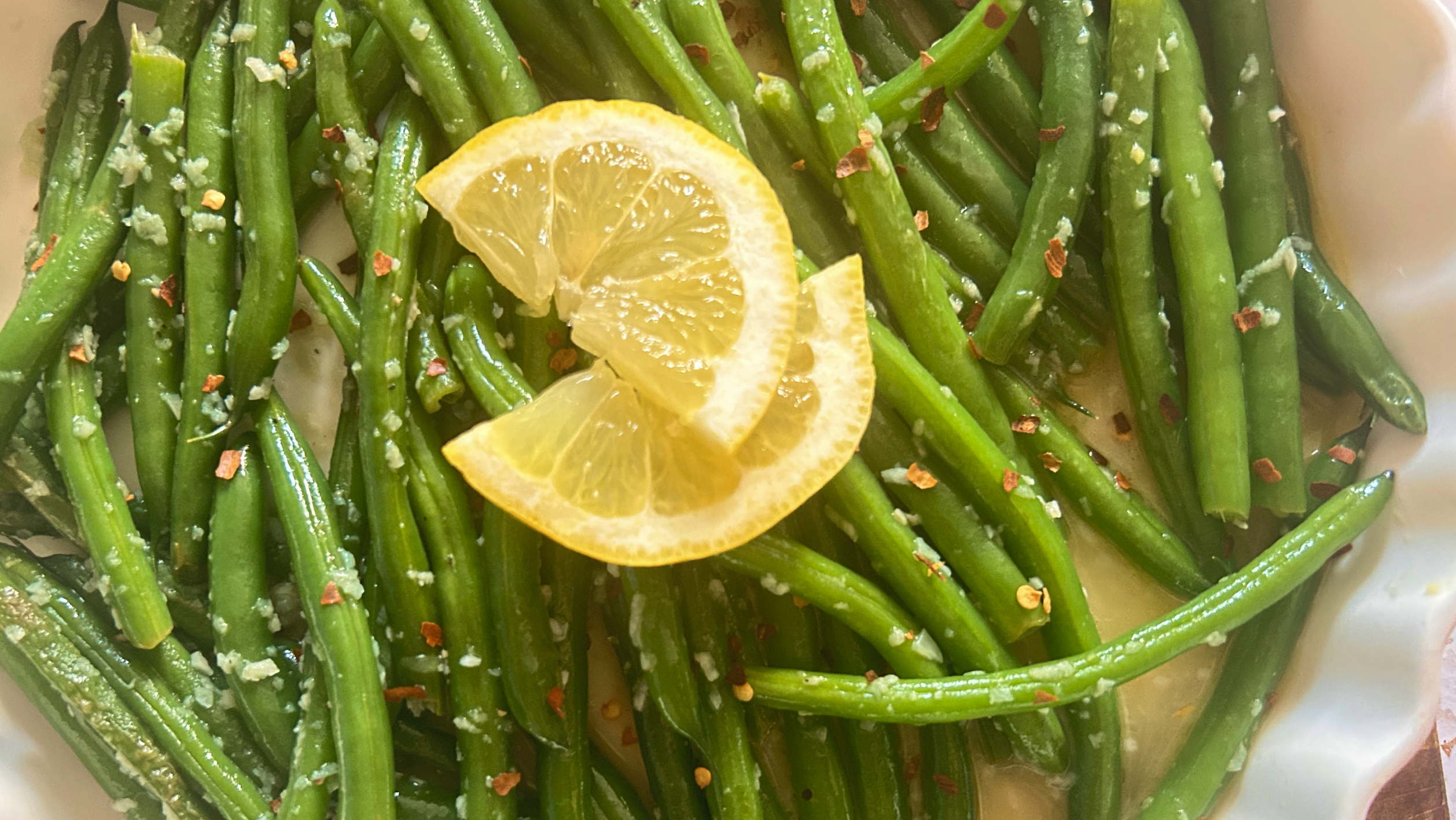 Gopuff: Green beans with garlic, red pepper flakes, and lemon slices. Order fresh vegetables now.