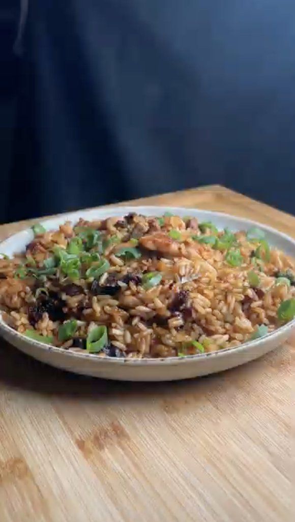 Gopuff jambalaya with chicken, sausage, and rice, topped with green onions. Order now!