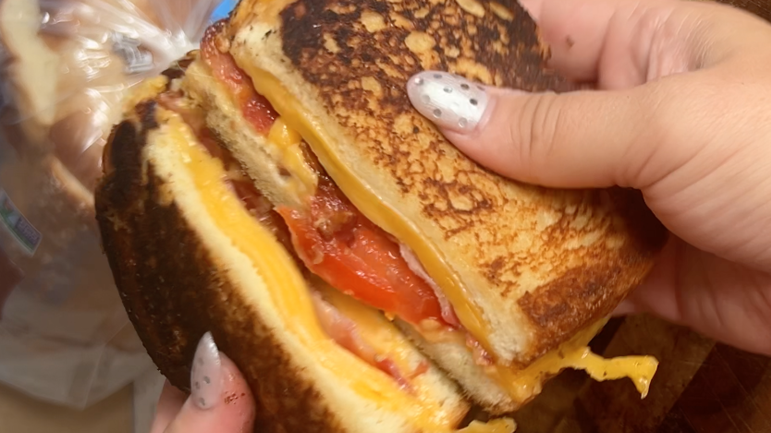 Gopuff grilled cheese sandwich with melted cheese and sliced tomatoes. Order hot sandwiches.
