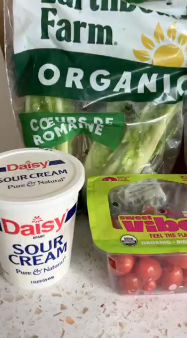 Gopuff groceries: Daisy Sour Cream, Earthbound Farm Organic Romaine Hearts, Sweet Vibe Organic Cherry Tomatoes.